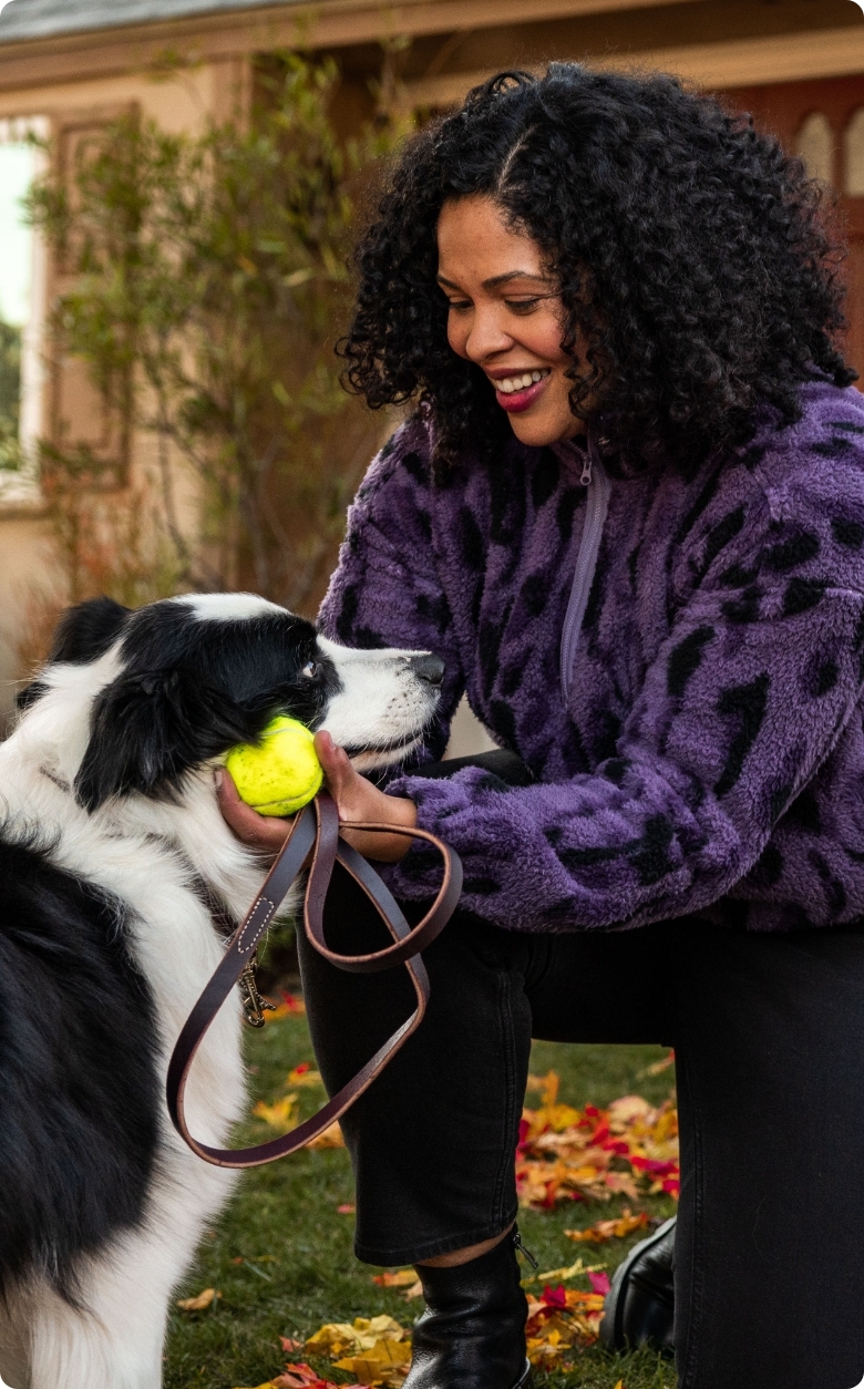 Woman smiling at dog