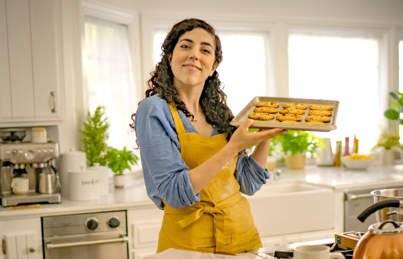 Image: BENLYSTA Patient Erica holding cookies